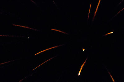 Full frame shot of illuminated light painting against black background