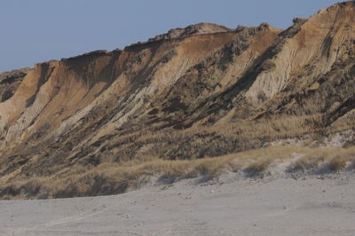 Scenic view of arid landscape against clear sky