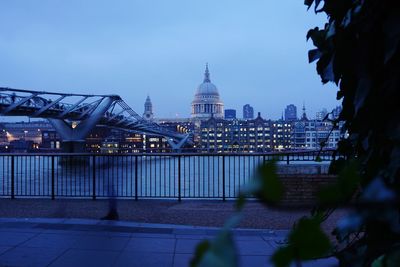 Illuminated buildings in city at dusk