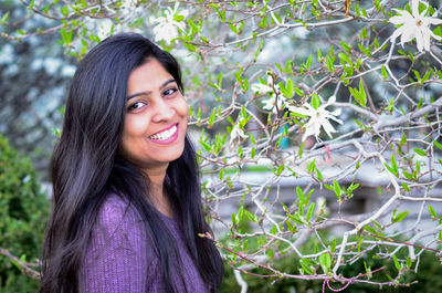 Portrait of a smiling young woman outdoors