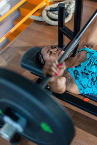 Portrait of young woman exercising in gym