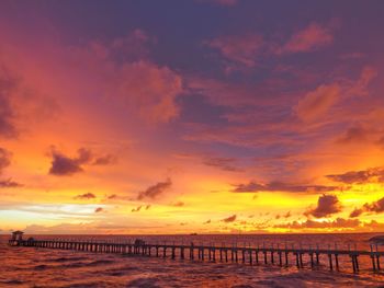 Scenic view of beach against sky during sunset