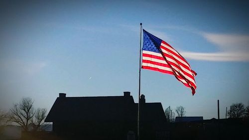 Low angle view of flag against sky