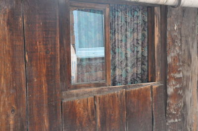 Close-up of window of abandoned building