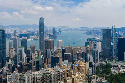 High angle view of modern buildings in city against sky