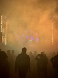 Silhouette people at sunset