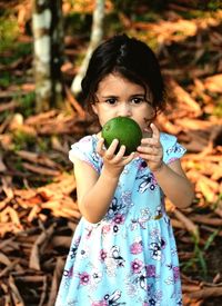 Portrait of girl holding ice cream