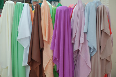 Close-up of clothes hanging in store