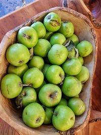 High angle view of apples in basket on table