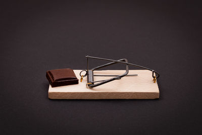 High angle view of piano on table against black background
