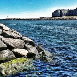 Scenic view of sea against blue sky