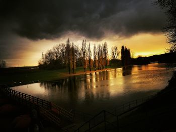 Scenic view of lake against sky during sunset