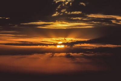 Low angle view of dramatic sky during sunset