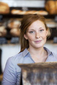 Young woman working in cafe, stockholm, sweden