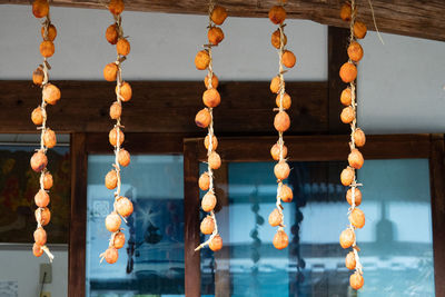 Low angle view of lanterns hanging on building