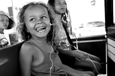 Happy children sitting in vehicle