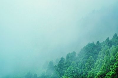 Scenic view of mountain against cloudy sky