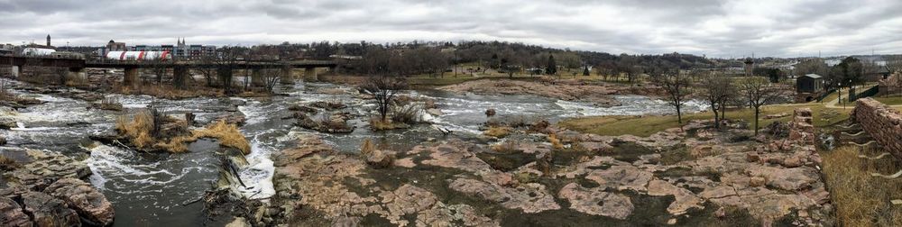 The big sioux river flows over rocks in sioux falls south dakota with views
