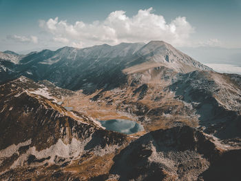 Aerial view of snowcapped mountains against sky