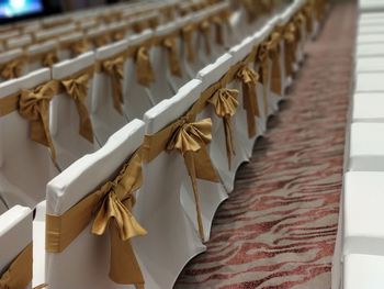 Ribbons tied up on chairs arranged in auditorium