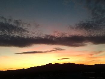 Scenic view of landscape against cloudy sky