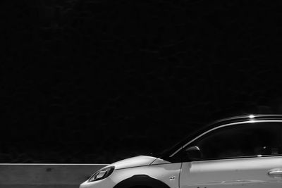 Close-up of car on black background