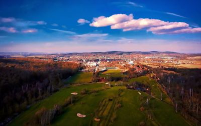 Aerial view of landscape against cloudy sky