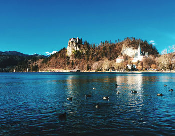 Scenic view of lake against blue sky