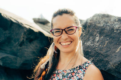 Portrait of smiling woman standing outdoors