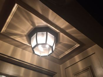 Low angle view of illuminated ceiling