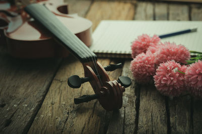 High angle view of pink flower on table