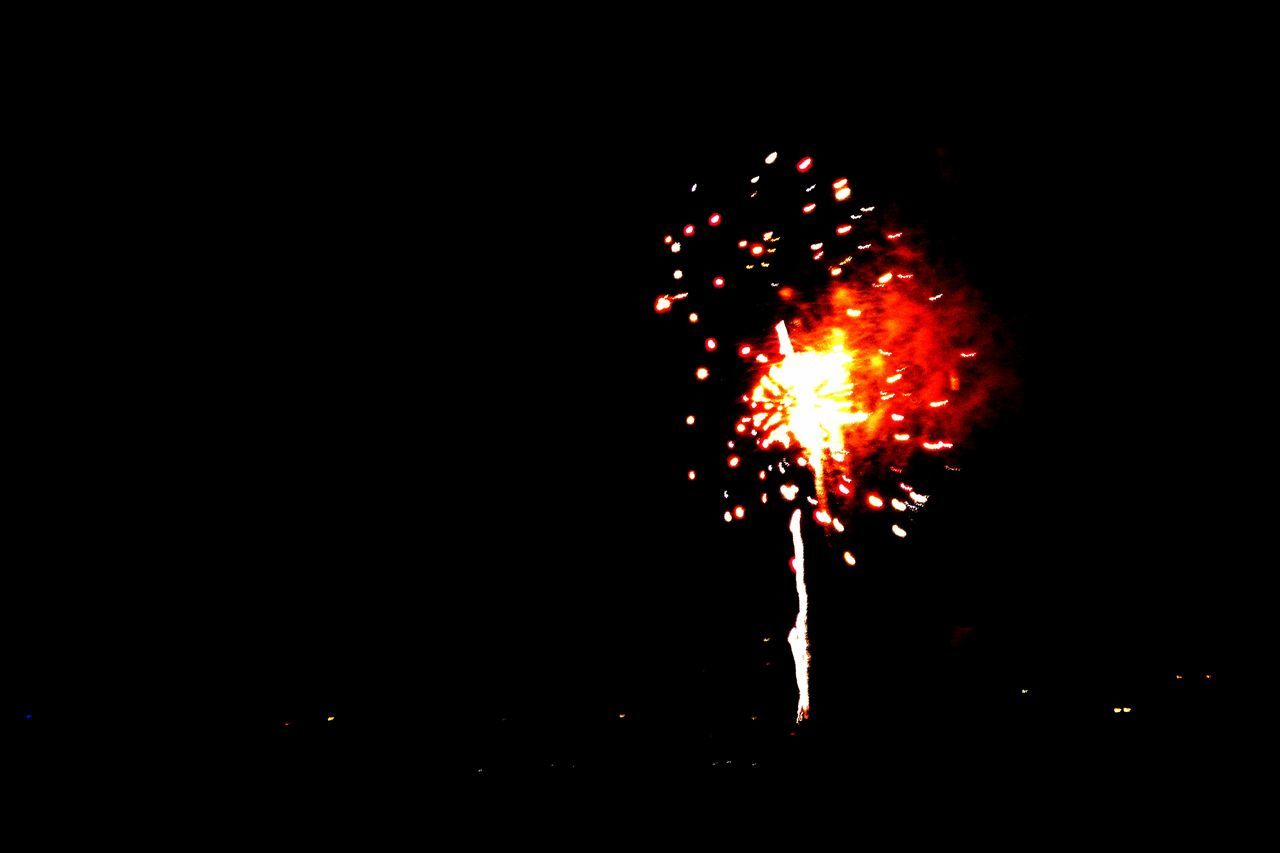 night, firework display, illuminated, celebration, red, exploding, motion, glowing, low angle view, sparks, firework, dark, sky, entertainment, outdoors, celebration event, no people, light, black color