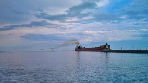 Scenic view of sea against cloudy sky