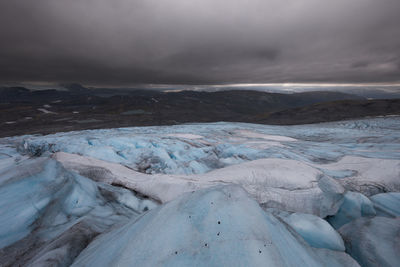 Scenic view of landscape against sky during winter