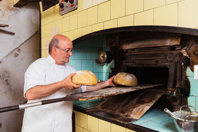 Midsection of man preparing food