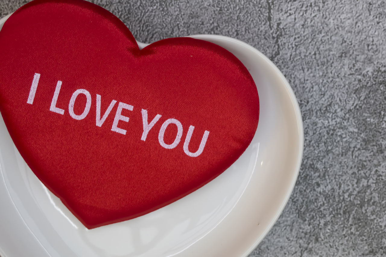 CLOSE-UP OF HEART SHAPE MADE ON TABLE