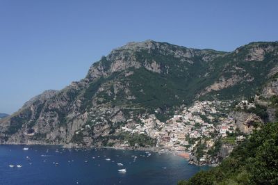 Scenic view of mountains against clear blue sky