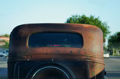 Close-up of old car against clear sky