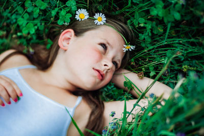 Cute girl lying on field