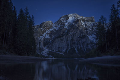 Scenic view of mountain against sky at night