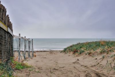 Scenic view of beach against sky