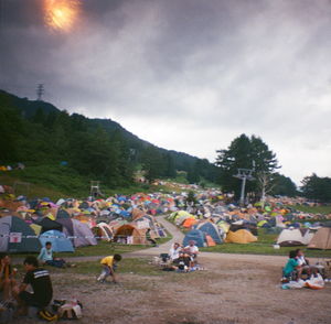 People on landscape against sky