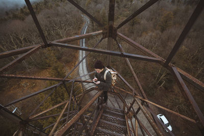 High angle view of man standing on bridge