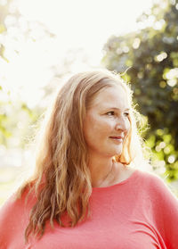 Portrait of a smiling young woman looking away