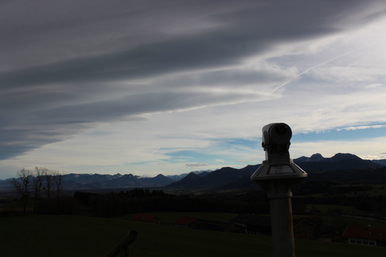 CROSS ON LANDSCAPE AGAINST SKY