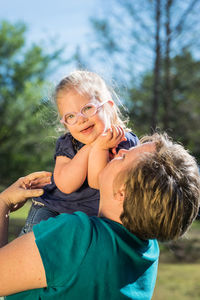 Happy mother and daughter at park