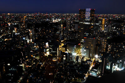 High angle view of illuminated cityscape at night