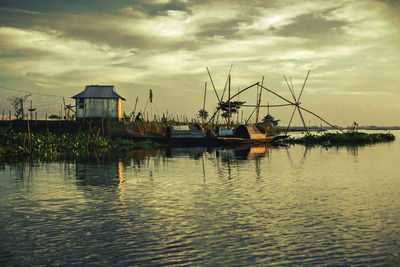 Scenic view of lake against sky during sunset