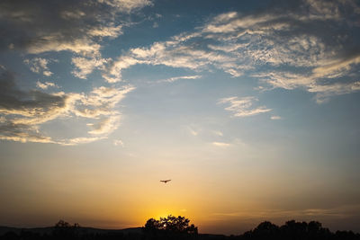 Scenic view of silhouette landscape against sky during sunset