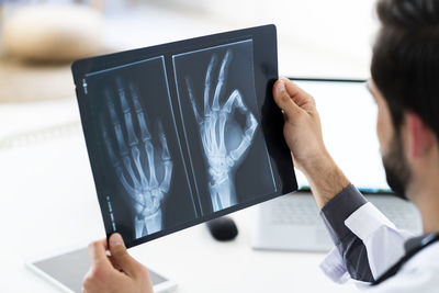 Male doctor examining medical x-ray